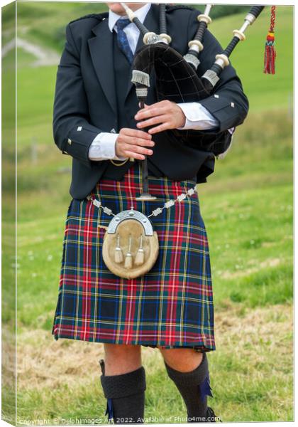 Scottish bagpiper in traditional kilt in the Highl Canvas Print by Delphimages Art