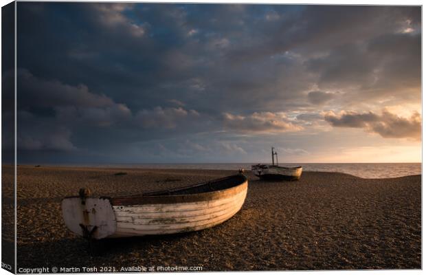 Ready. Old rowing boats on shingle beach Canvas Print by Martin Tosh
