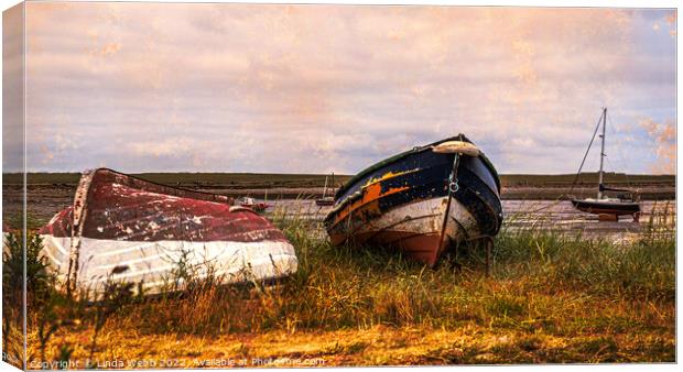 Abandoned boats on the shore of Lindisfarne, Holy Island, Northumberland, England Canvas Print by Linda Webb