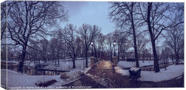 Panorama of a snowy city park during in the evening Canvas Print by Maria Vonotna