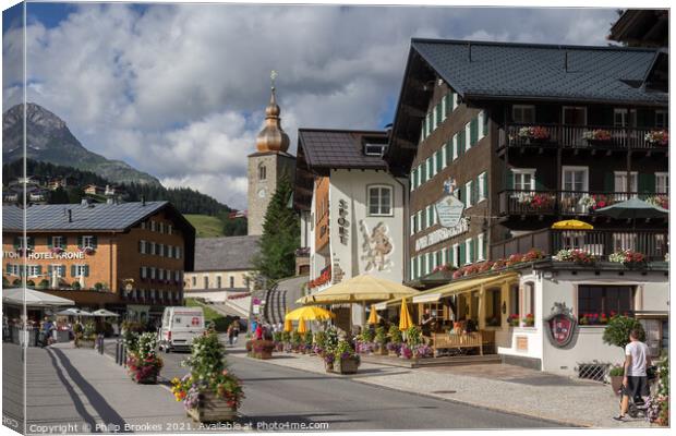 High Street in Lech, Austria Canvas Print by Philip Brookes