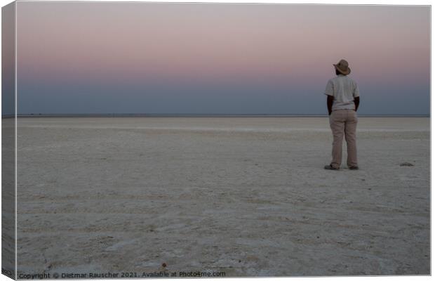 Dusk in Makgadikgadi Salt Pan - Black Man Gazing at Horizon Canvas Print by Dietmar Rauscher
