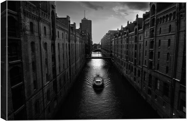 Boat on Kehrwiederfleet in the Speicherstadt of Hamburg Canvas Print by Dietmar Rauscher