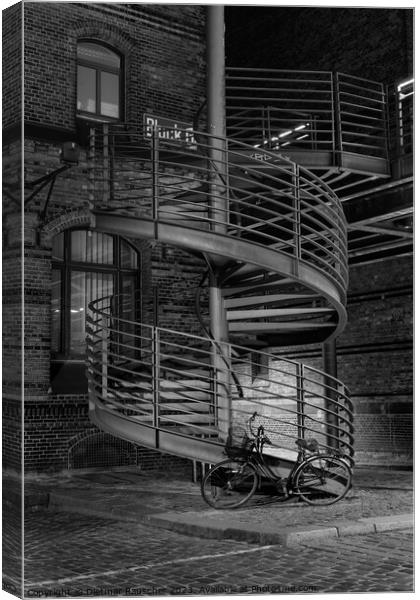 Spiral Staircase and Bicycle in the Speicherstadt of Hamburg Canvas Print by Dietmar Rauscher