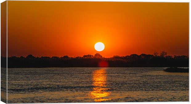 Ethereal Sunset: The Water's Mirror Canvas Print by Margaret Ryan