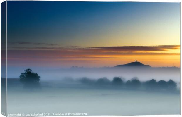 Majestic Sunrise Over Glastonbury Tor Canvas Print by Les Schofield