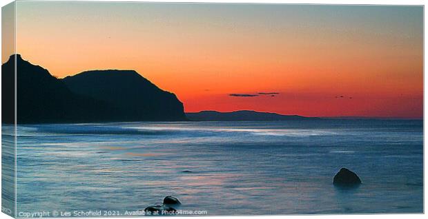 Charmouth Sunrise Over Red Scar Canvas Print by Les Schofield