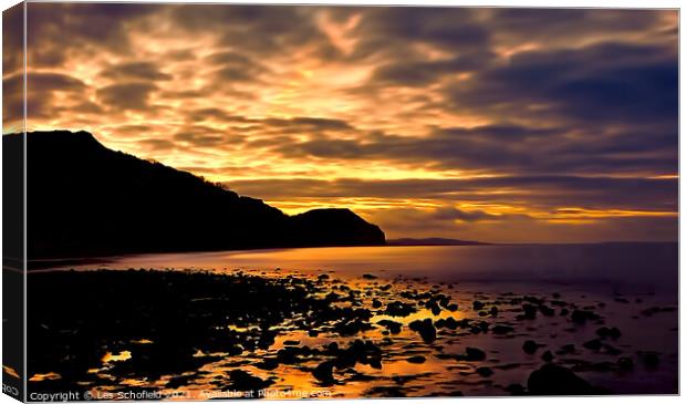 Charmouth Sunrise Canvas Print by Les Schofield