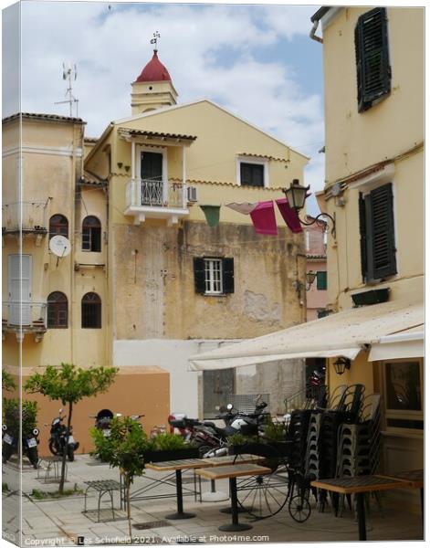 Square in Corfu town  Canvas Print by Les Schofield