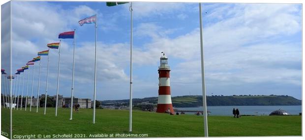 Plymouth Hoe  lighthouse and flags Canvas Print by Les Schofield