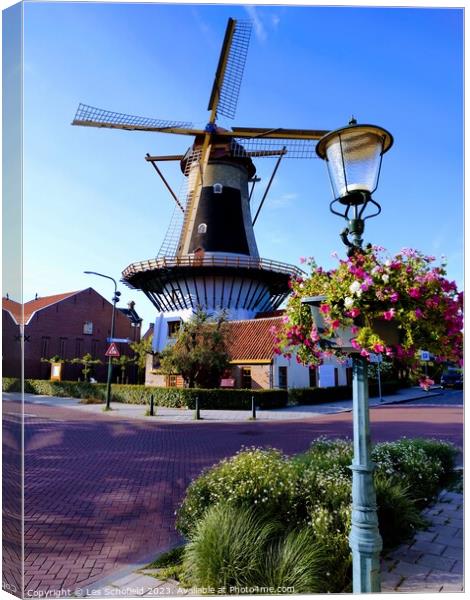 Windmill in wassaner Netherlands  Canvas Print by Les Schofield