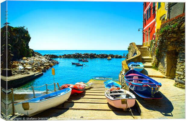 Riomaggiore village, boats and sea. Cinque Terre, Italy, Canvas Print by Stefano Orazzini