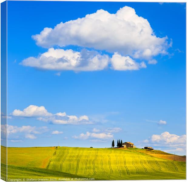 Tuscany, farm on the top of the hill and a cloud. Pienza, Italy Canvas Print by Stefano Orazzini