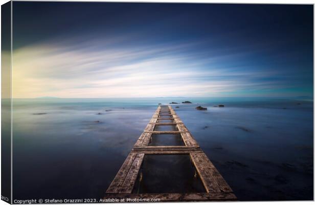 Wooden pier remains in a blue sea. Long Exposure. Canvas Print by Stefano Orazzini