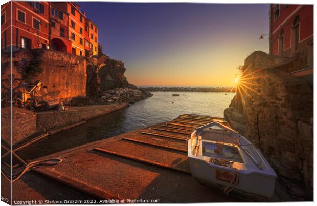 Riomaggiore village, a boat in front of the sea. Cinque Terre Canvas Print by Stefano Orazzini