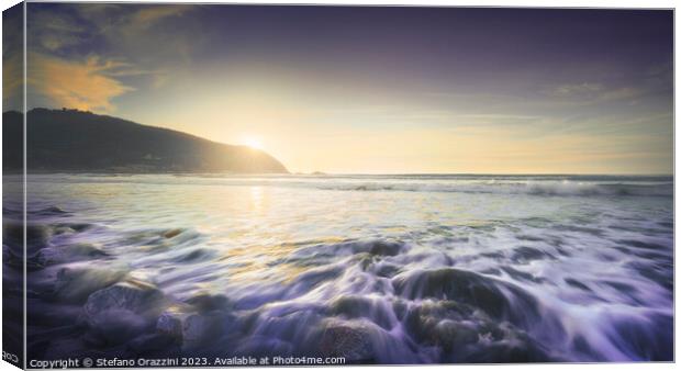 Waves on Baratti beach at sunset. Tuscany, Italy Canvas Print by Stefano Orazzini