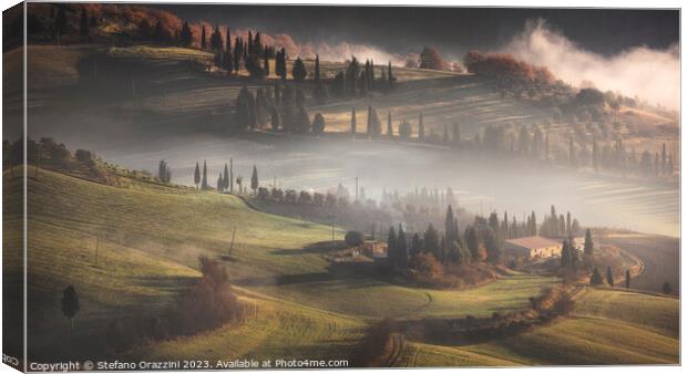 Foggy morning in Val d'Orcia. Tuscany, Italy Canvas Print by Stefano Orazzini
