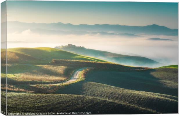 Foggy morning landscape in Volterra. Tuscany, Italy Canvas Print by Stefano Orazzini