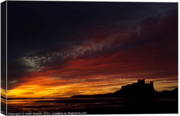 Bamburgh Castle at sunrise Canvas Print by Keith Bowser