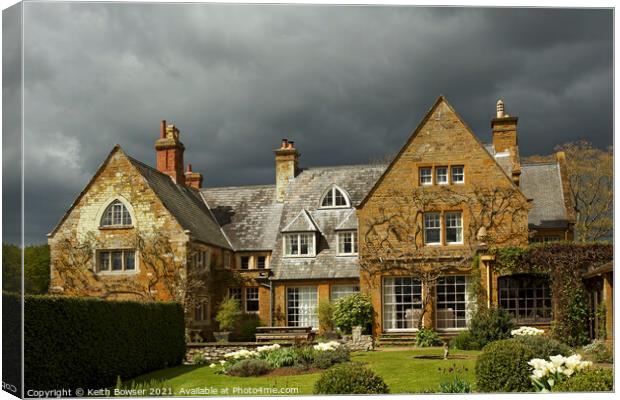 Coton Manor with approaching storm Canvas Print by Keith Bowser