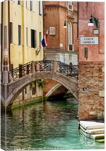 Calm Quiet Canal in Venice Italy Canvas Print by John Gilham