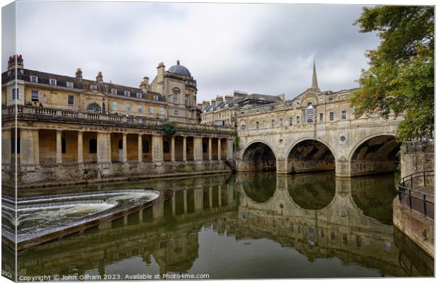 Pulteney Bridge and the weir on the river Avon in Bath Somerset England UK Canvas Print by John Gilham