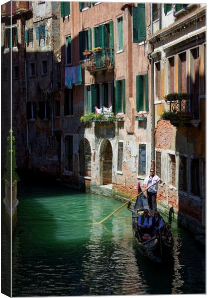 Gondola Ride in Venice Italy Canvas Print by John Gilham