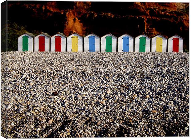 Row of colorful beach huts Canvas Print by nick pautrat