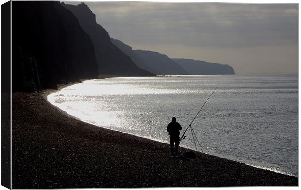 Fisherman angling on beach Canvas Print by nick pautrat