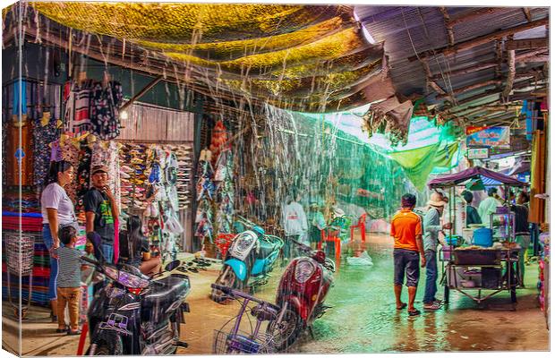 When the big Rain comes to the Chongchom Market in Surin somewhere in Isan Thailand Canvas Print by Wilfried Strang