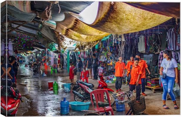 When the big Rain comes to the Chongchom Market in Surin somewhere in Isan Thailand Canvas Print by Wilfried Strang