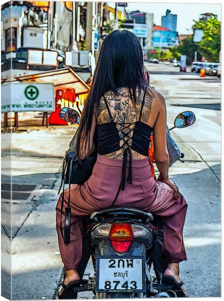 a young tattooed Thai woman on a motorcycle Canvas Print by Wilfried Strang