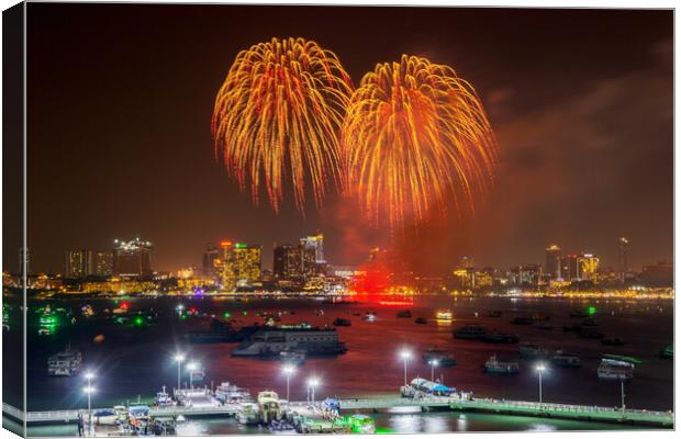 fantastic and colorful fireworks display over the night sky of the city during a festival Canvas Print by Wilfried Strang