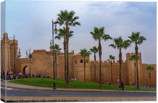 Brown Building with Palm trees of Rabat Citadel in Morocco. Canvas Print by Maggie Bajada