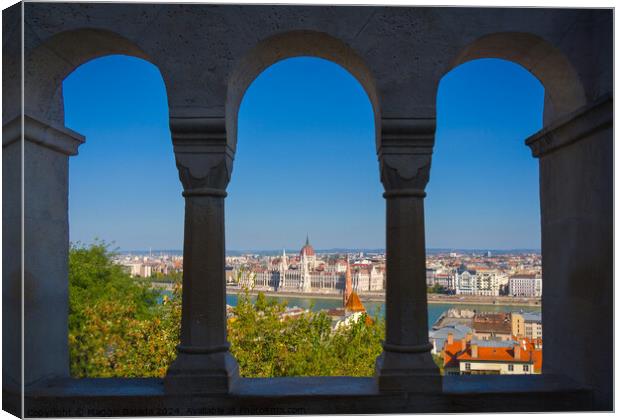 Framed Arch with view of Danube River and Budapest, Hungary. Canvas Print by Maggie Bajada