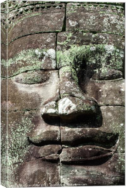 Stone face at Angkor Thom, Cambodia Canvas Print by Ian Miller