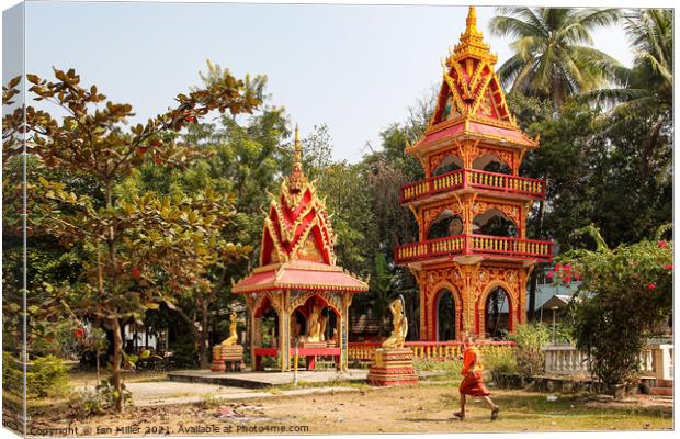 Buddhist Building with a Monk Canvas Print by Ian Miller