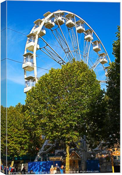 Ferris Wheel Behind the Trees Canvas Print by GJS Photography Artist