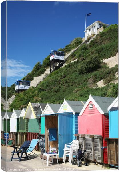 Charming Pastel Beach Huts Canvas Print by Roger Mechan