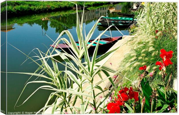 Serenity on the Canal Canvas Print by Roger Mechan