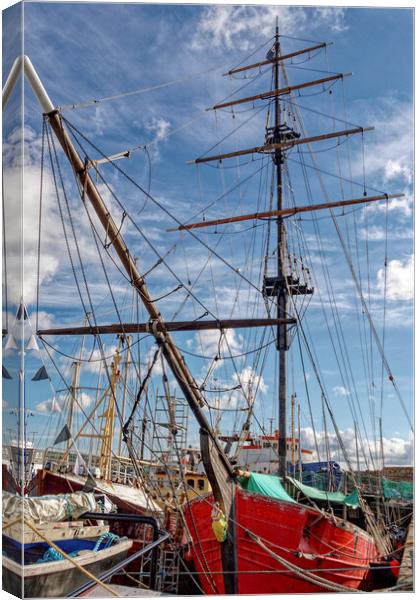 Red Sails Boldly Reflect in Penzance Harbour Canvas Print by Roger Mechan