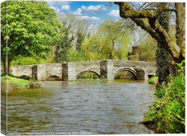 Ancient Stone Bridge Amidst a Flood Canvas Print by Roger Mechan