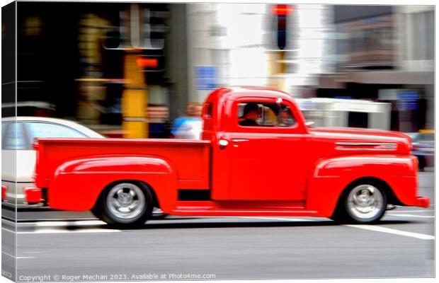 Red Monster Truck in Motion Canvas Print by Roger Mechan