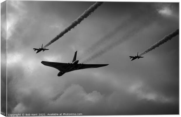 Vulcan XH558 with Red Arrows Escort Canvas Print by Bob Kent