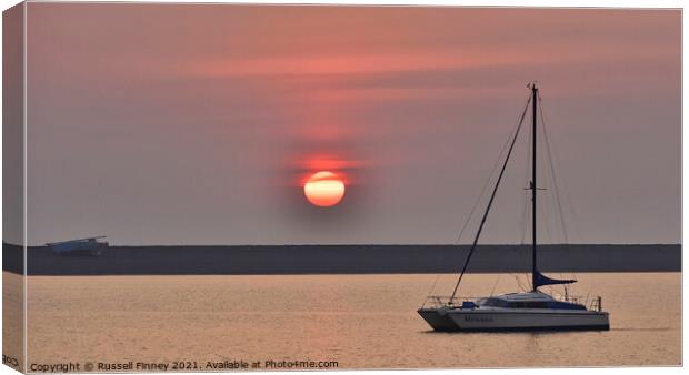 Sunset over Barrow-in-Furness and the Piel Channel  Canvas Print by Russell Finney