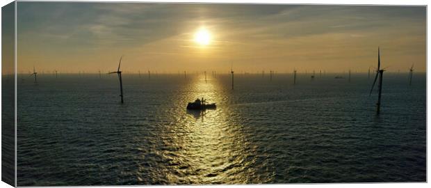 Sunset in wind turbines Canvas Print by Russell Finney