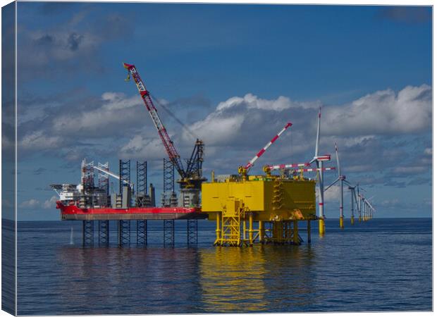 Offshore jackup installing turbine blades Canvas Print by Russell Finney