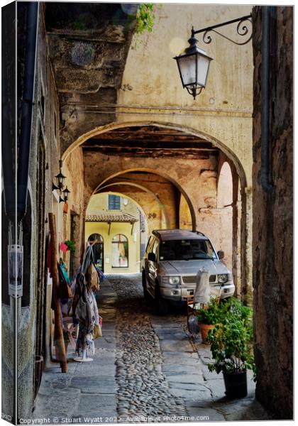 Italian Street Scene: Orta San Giulio Canvas Print by Stuart Wyatt