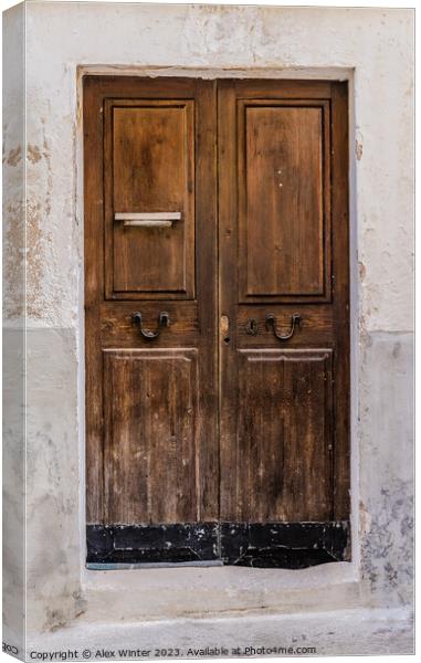 Weathered old brown wooden front door Canvas Print by Alex Winter