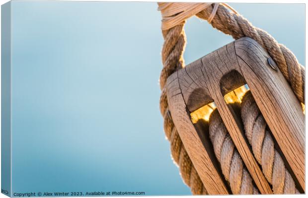 Detail image of wooden pulley with ropes of an classical sailing yacht Canvas Print by Alex Winter